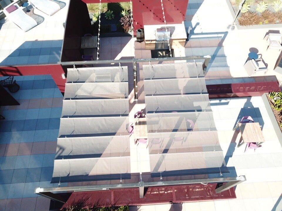 An aerial view of a building with a sign that says m on it