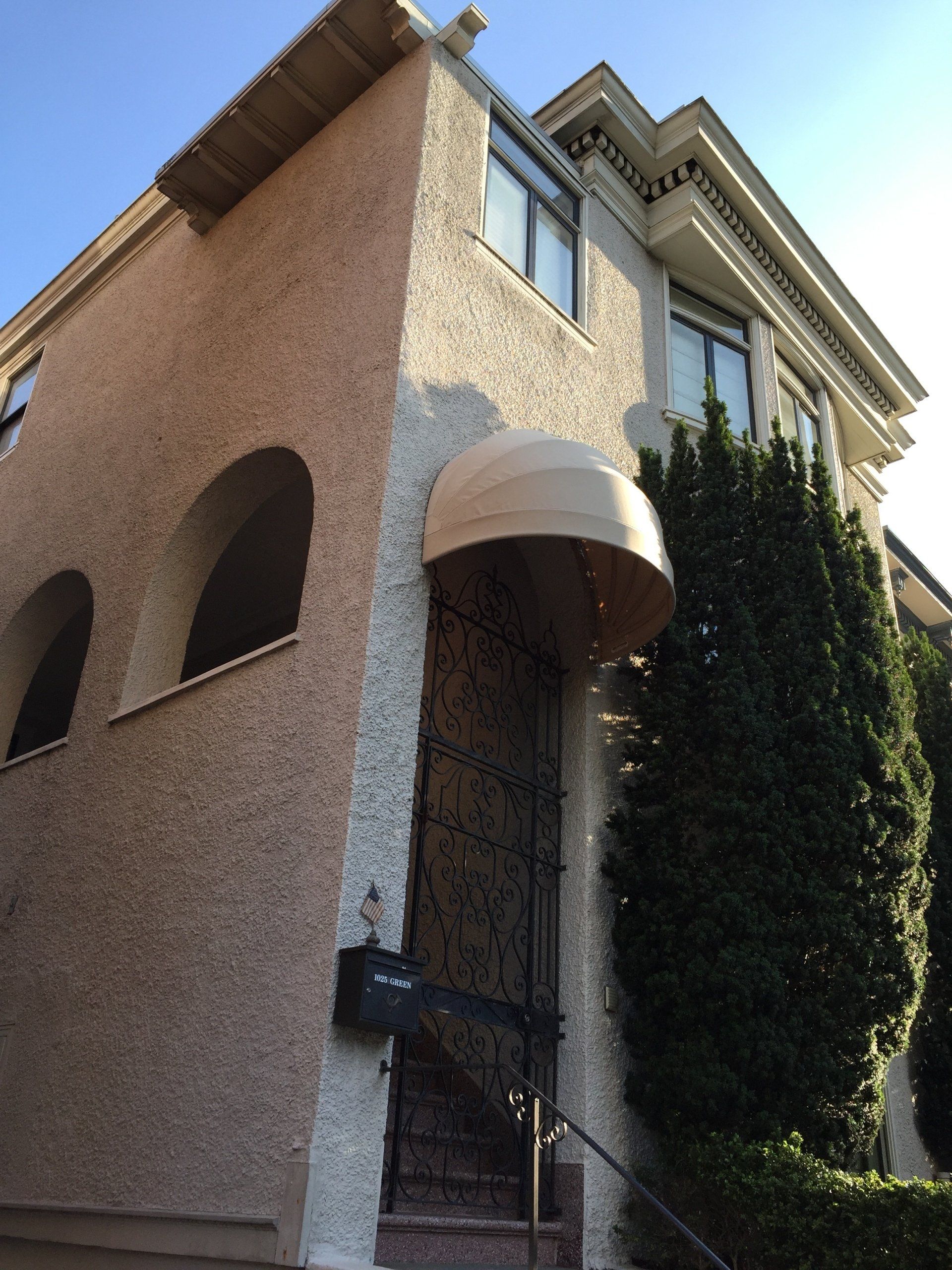 A building with a white awning over the front door