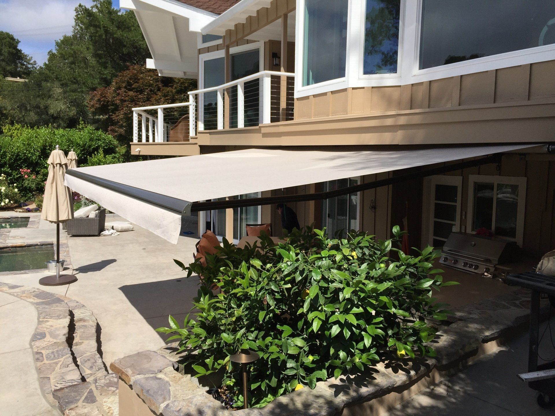 A house with a large awning on the side of it.