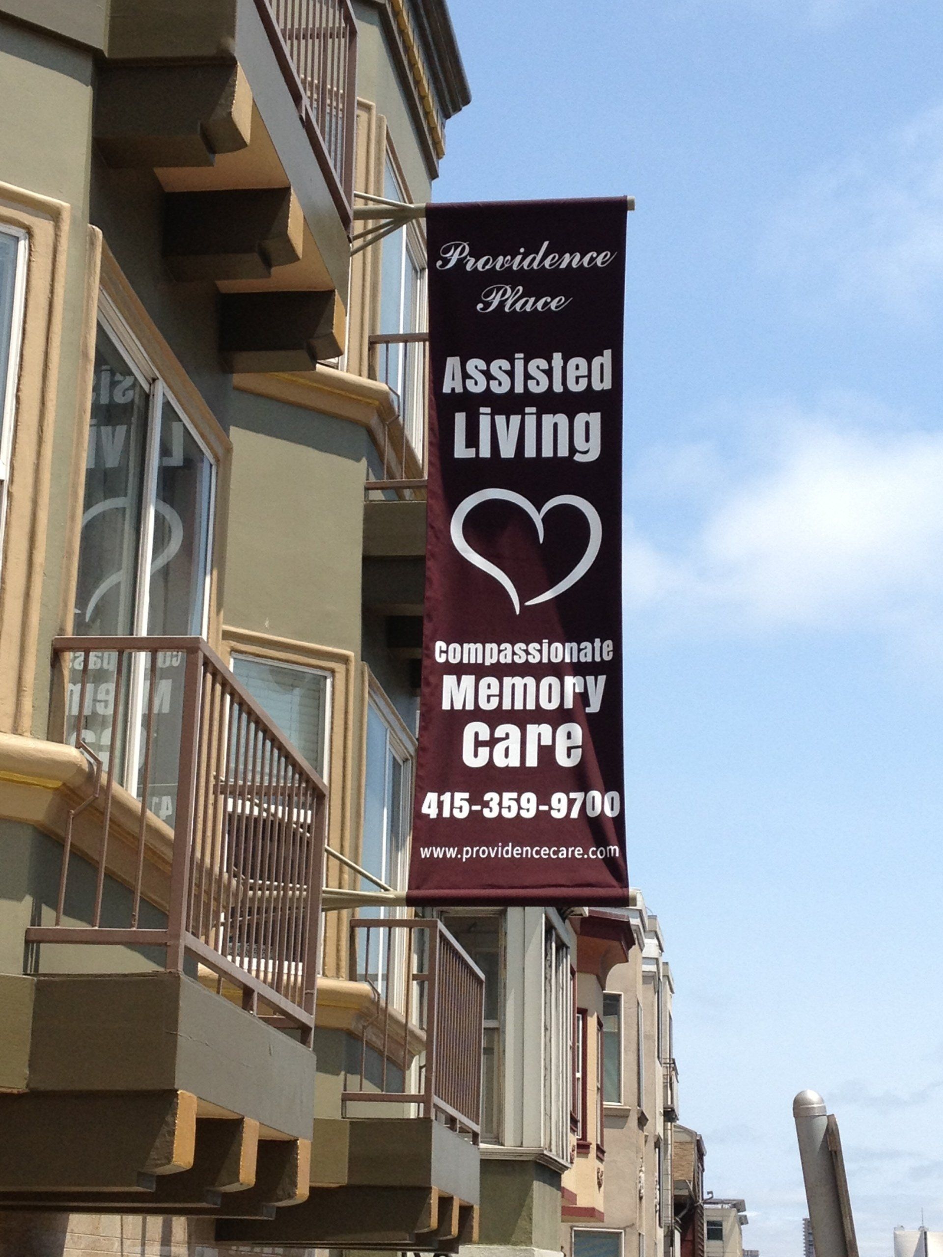 A building with a banner that says assisted living memory care
