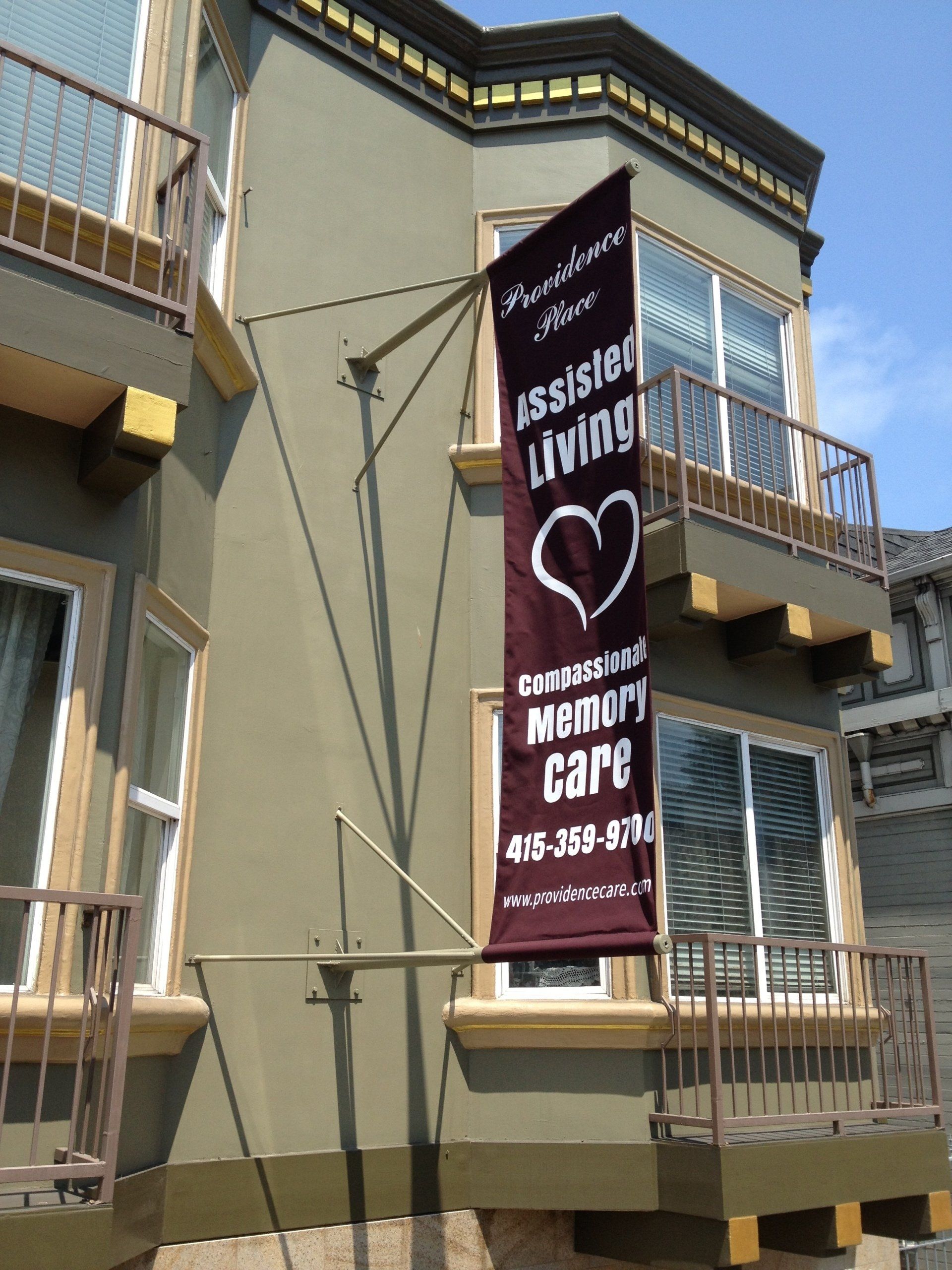 A building with a banner that says assisted living memory care
