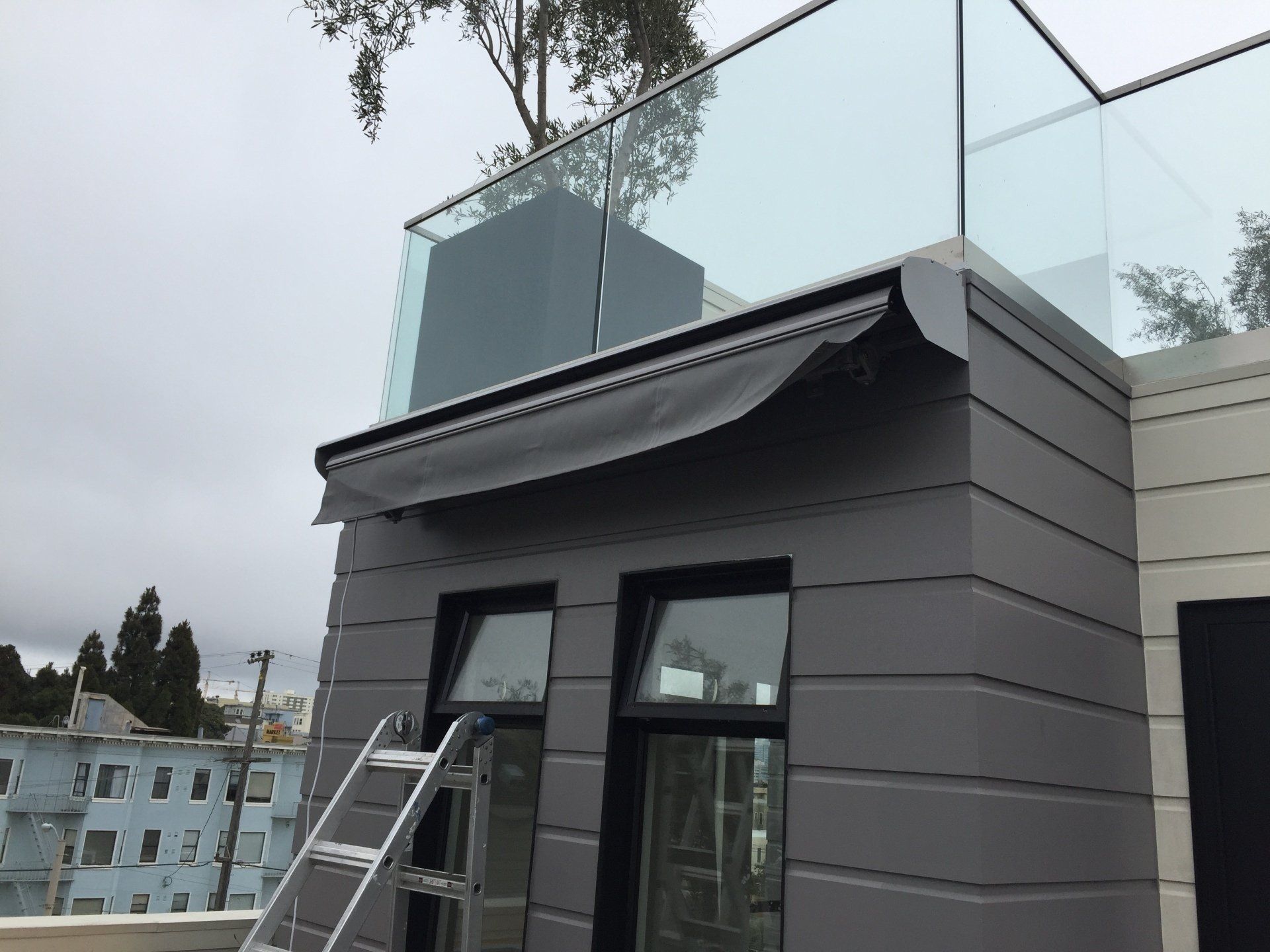 A building with a balcony and a ladder on it