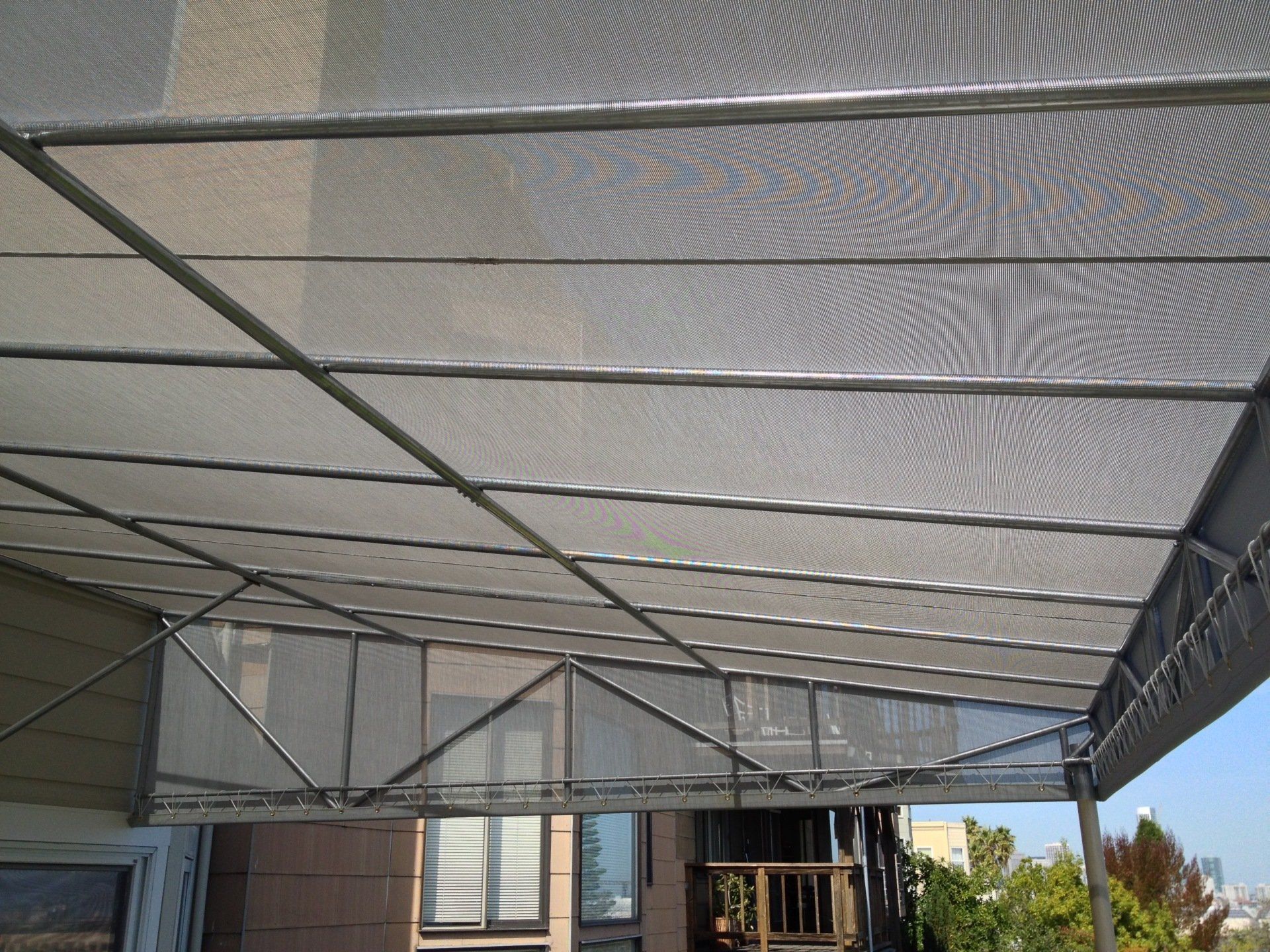 A canopy is covering a balcony of a house.