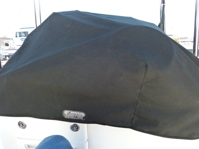 A boat with a black cover on top of it