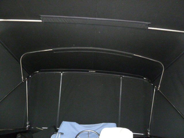 The inside of a boat with a black roof