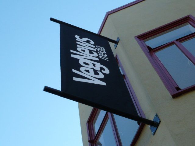 A sign on the side of a building that says vegnews