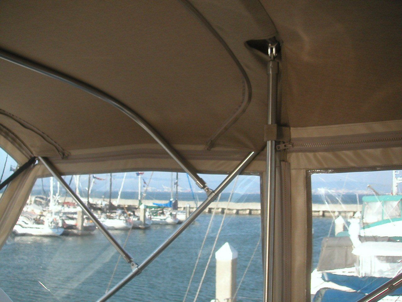 The inside of a boat with a view of the water
