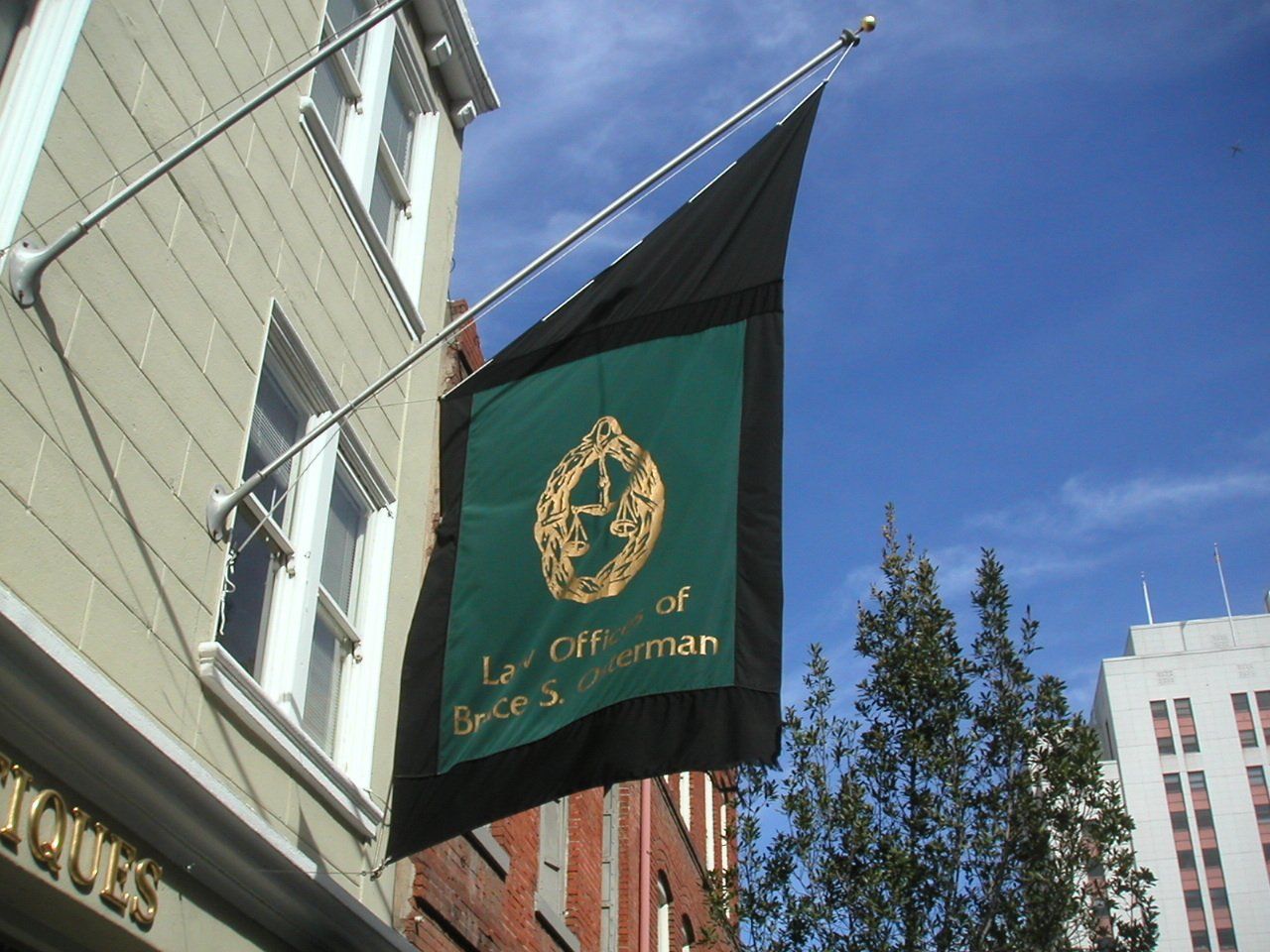 A green and black flag that says city of spice