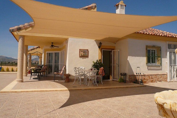 A house with a large umbrella over the porch