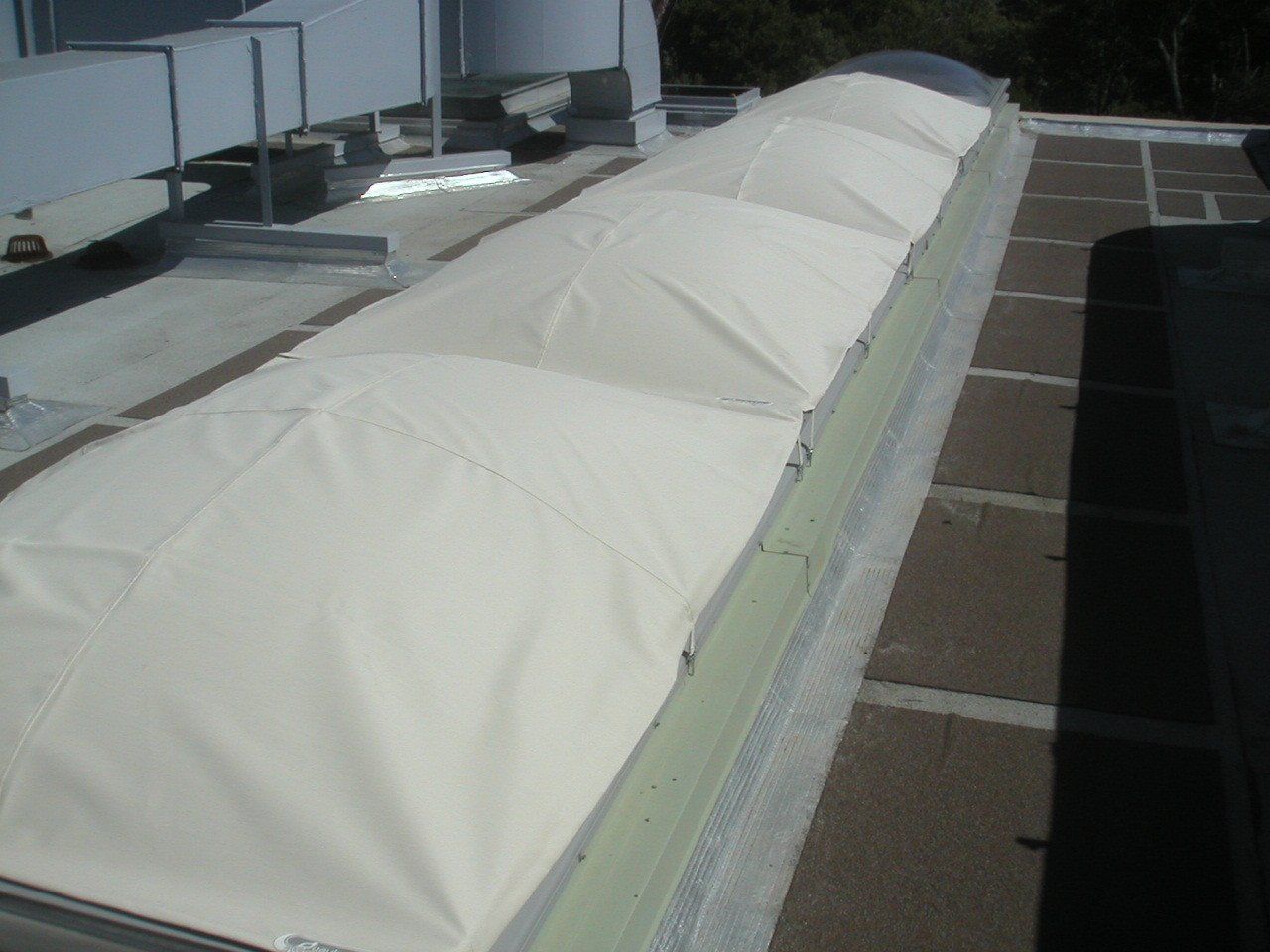 A roof with a lot of white sheets on it