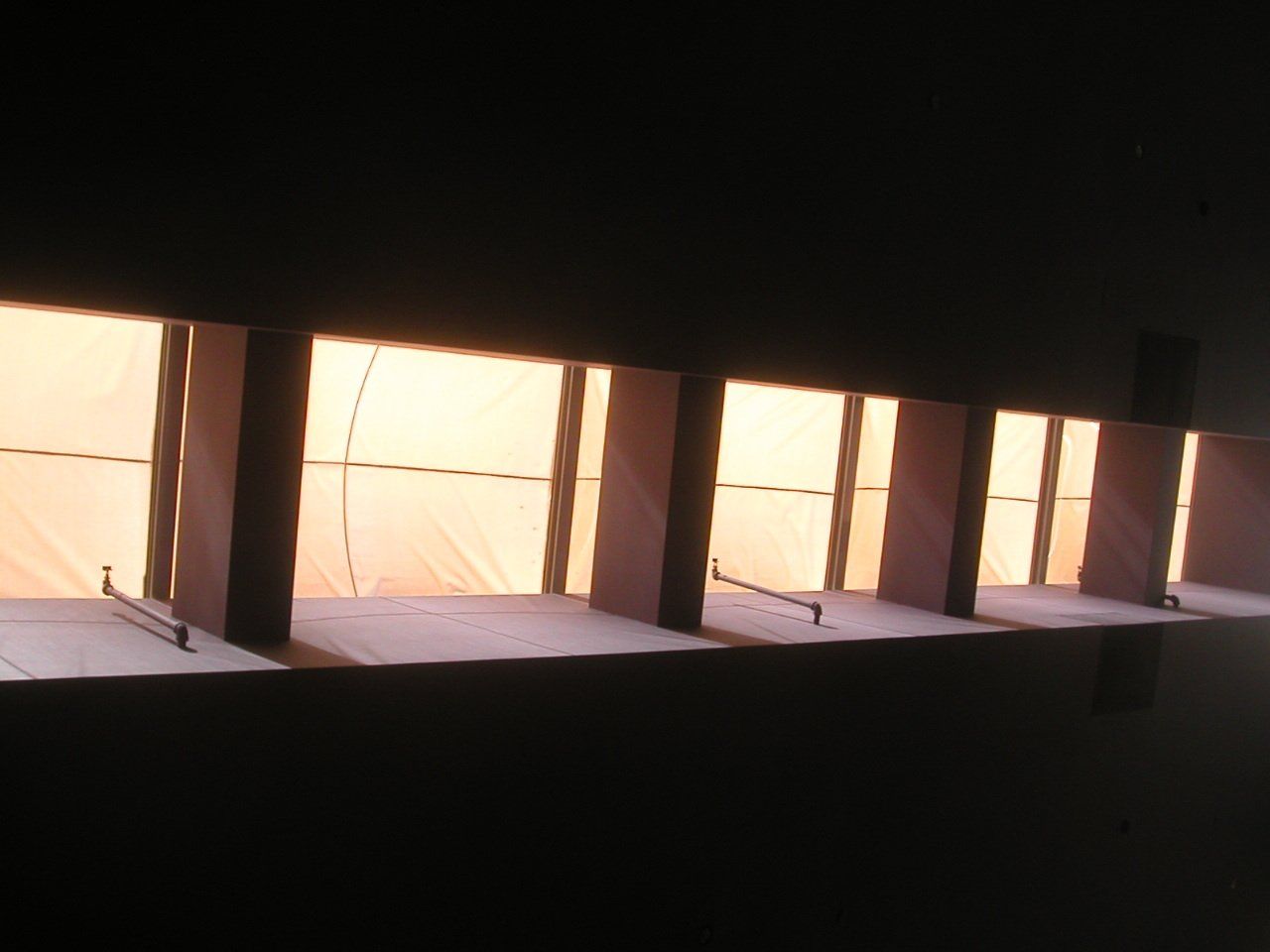 A row of windows with the sun shining through them