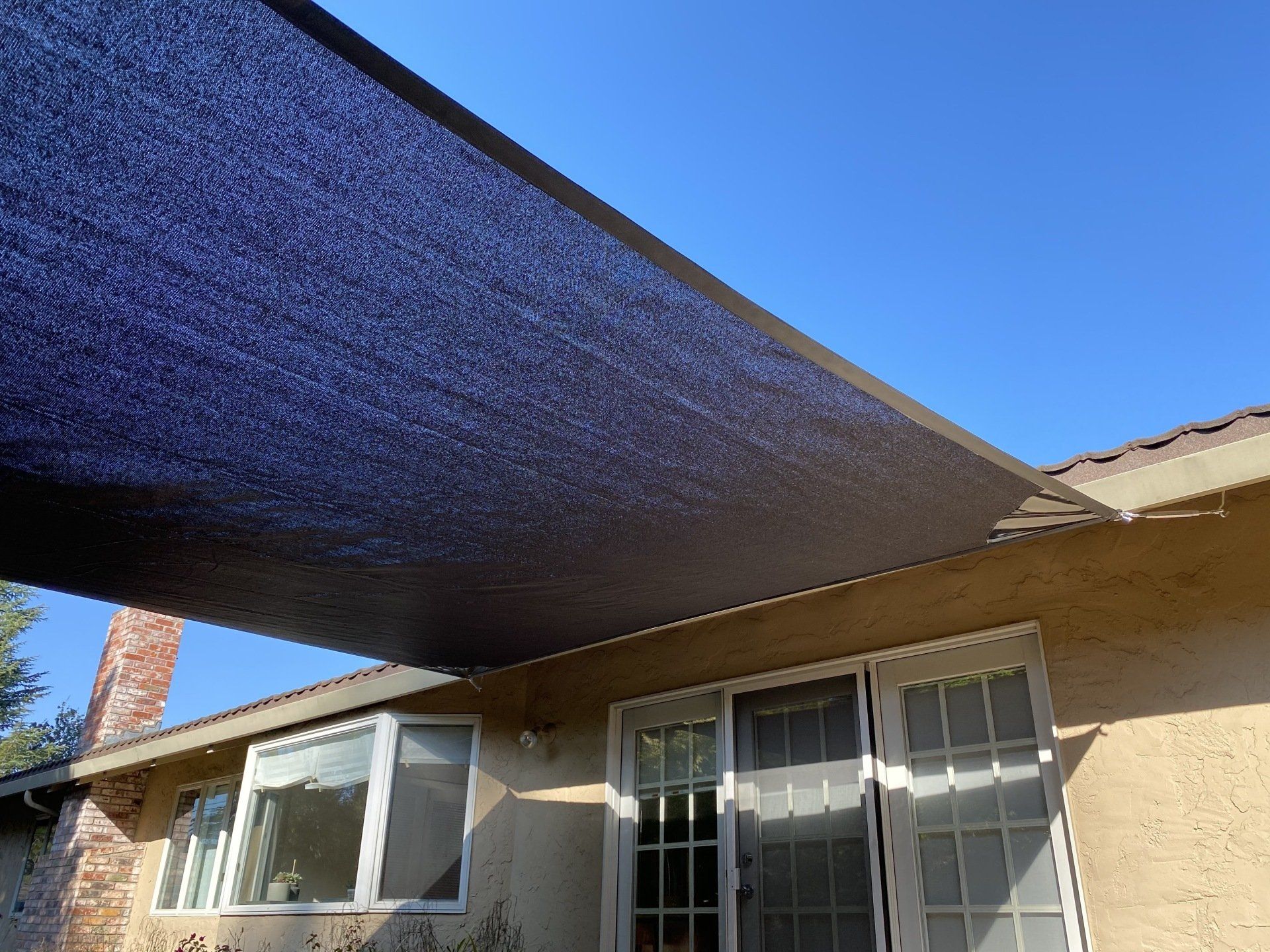 A house with a purple shade on the roof