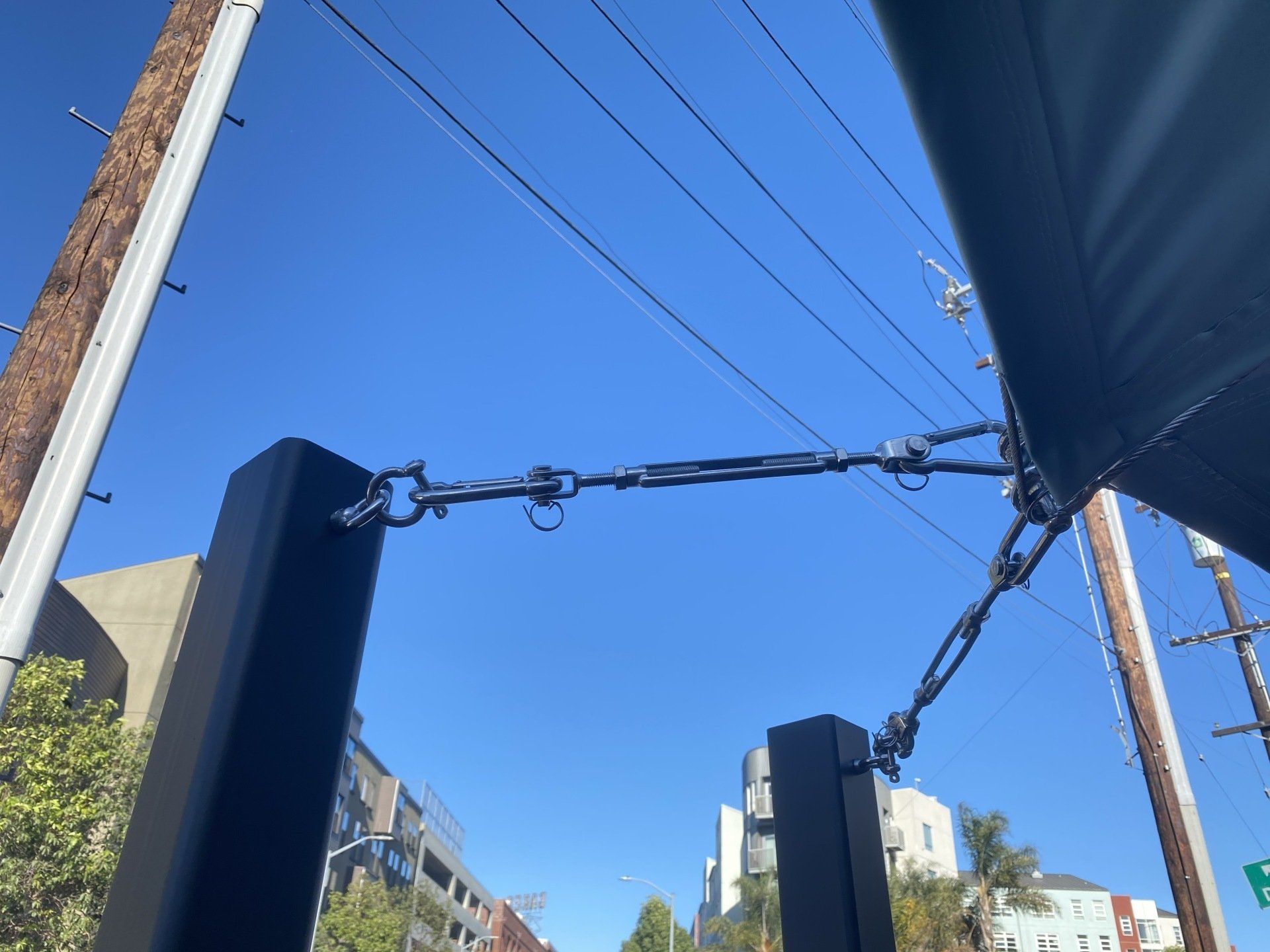 A close up of a fence with a blue sky in the background