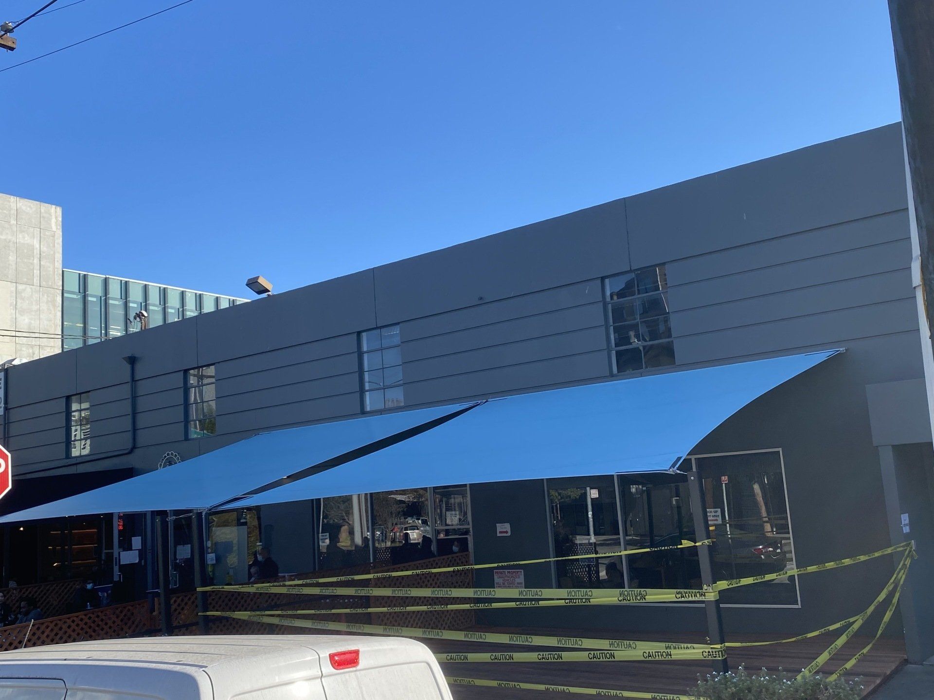 A building with a blue umbrella in front of it