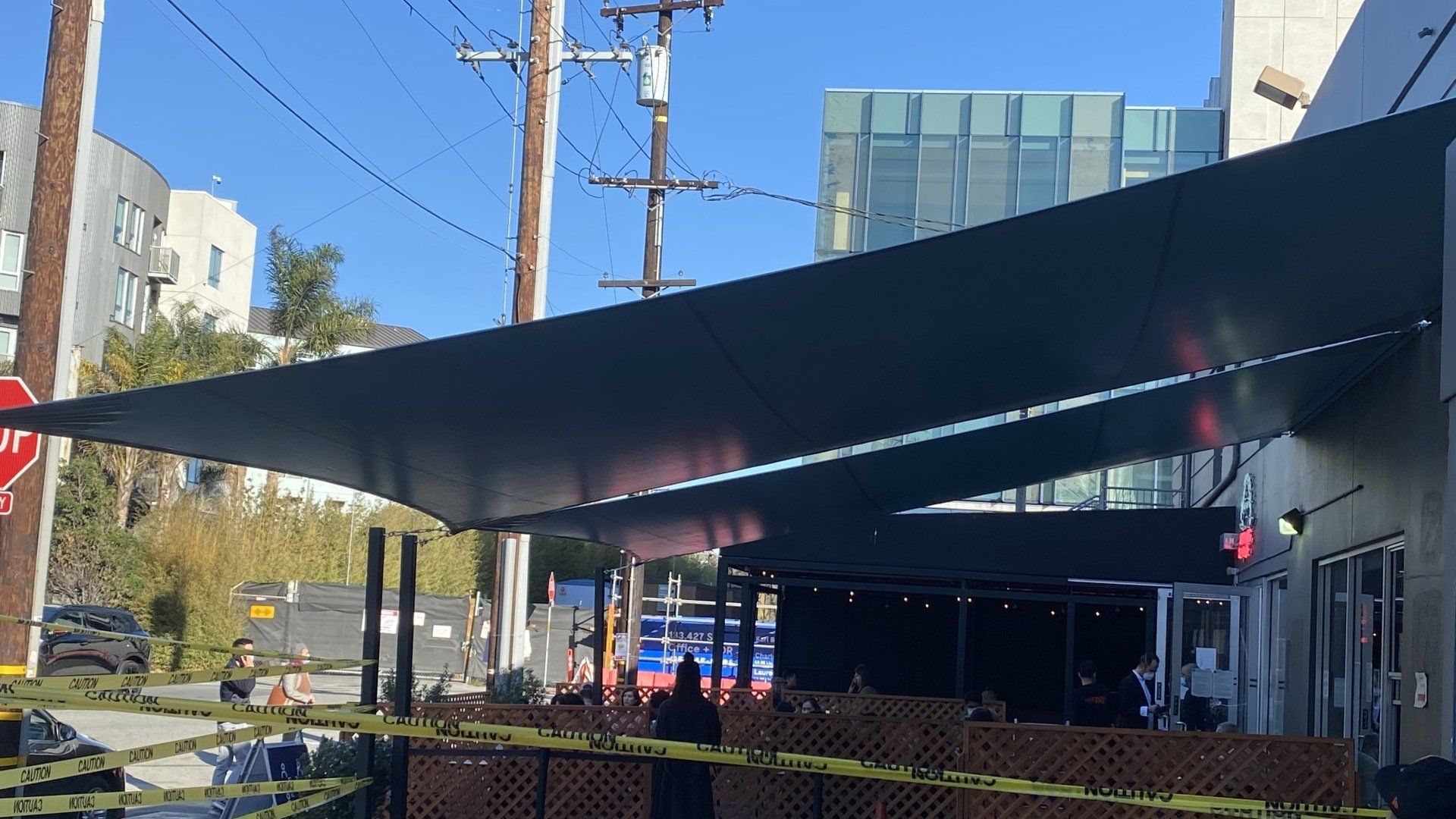 A large umbrella is sitting outside of a building.