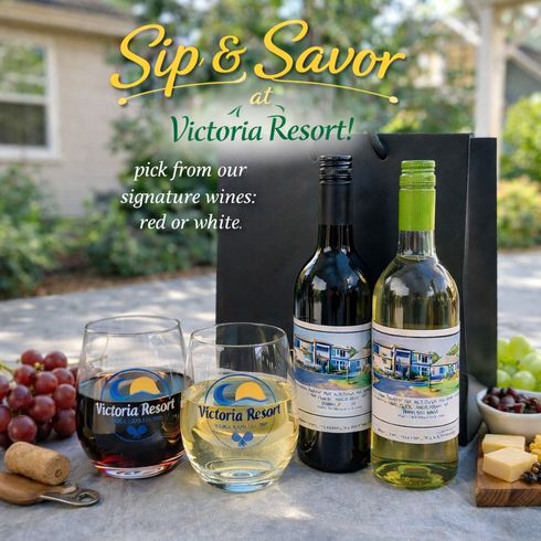 Wine bottles and glasses with the Victoria Resort logo. Promoting signature red or white wines.