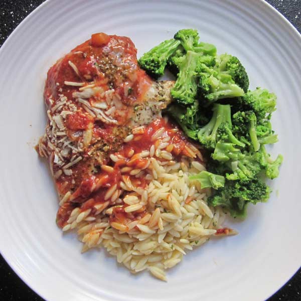 Herbed Chicken Parmesan with Marinara Sauce, Orzo, and Garlic Seasoned Broccoli