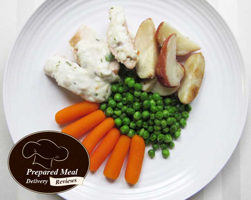 Chicken Breast with Tarragon Cream Sauce, Potato Wedges, and Peas and Baby Carrots