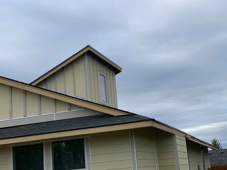 A house with a roof that has a window on it