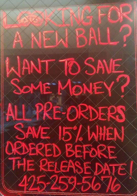 A sign that says looking for a new ball want to save some money all pre-orders save 15% when ordered before the release date