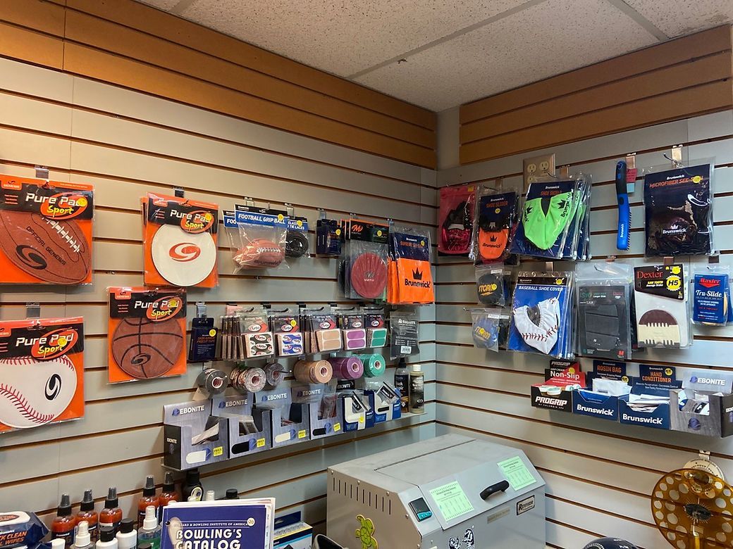 A store filled with lots of basketballs and other sports equipment.