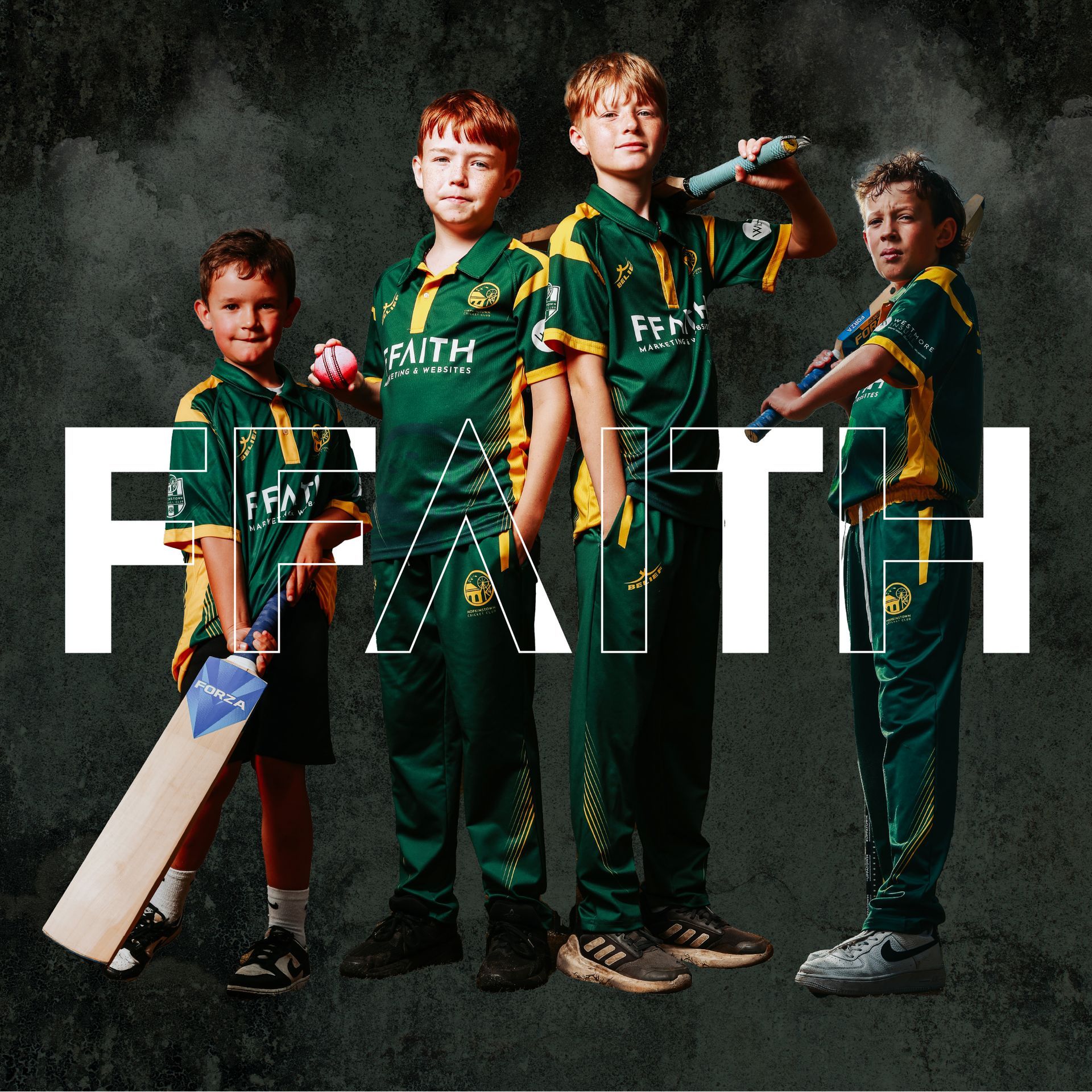 A group of young boys are standing in front of the word faith