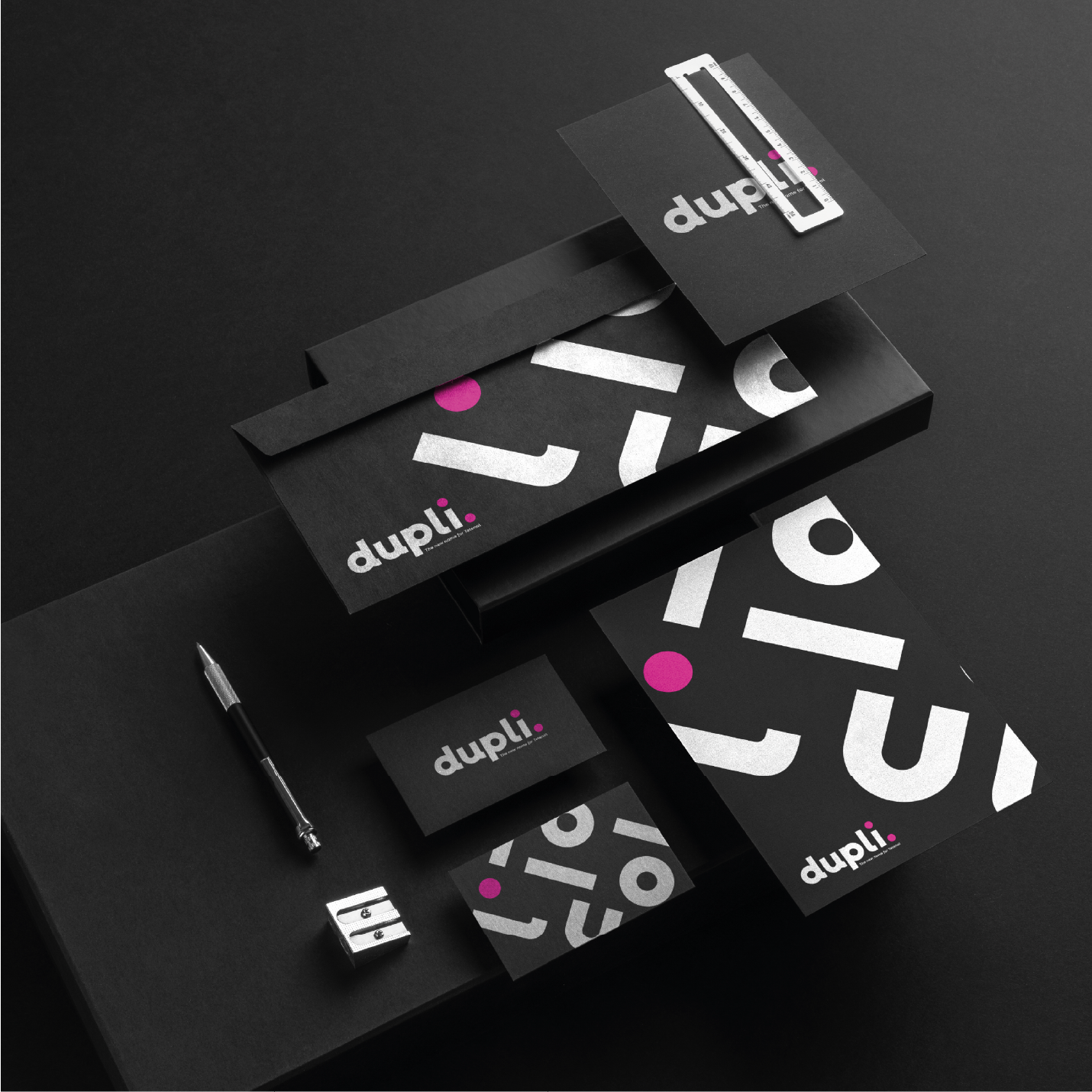 Stationery set: black with white and pink accents, logo