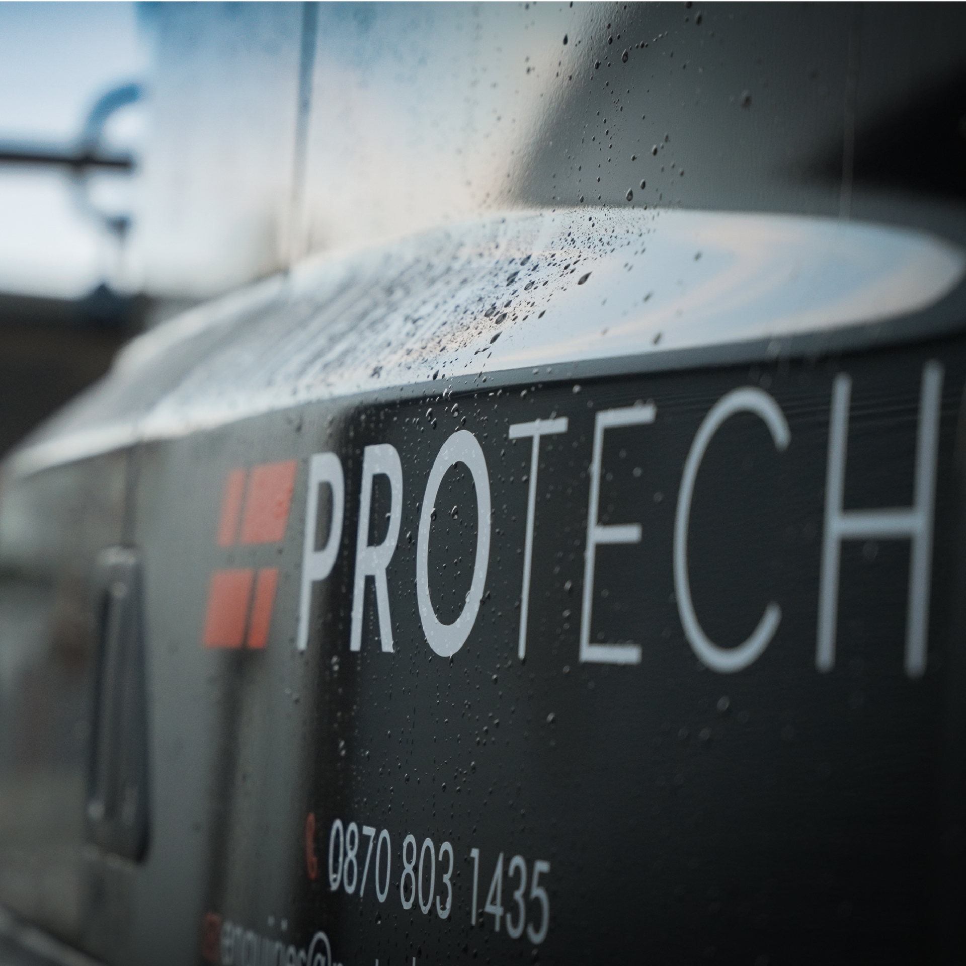 Close-up of a black vehicle with the word