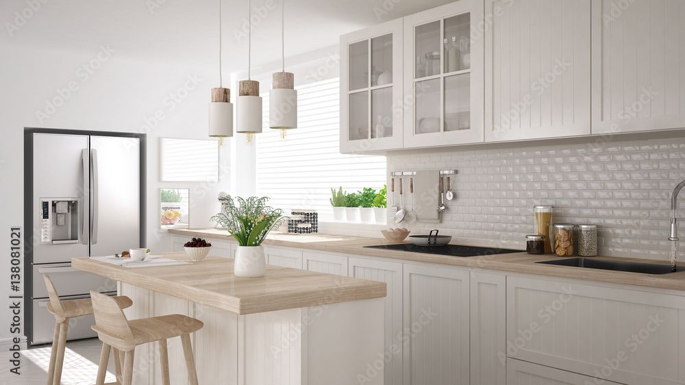 Bright white modern kitchen with island, wooden accents, and hanging lights.