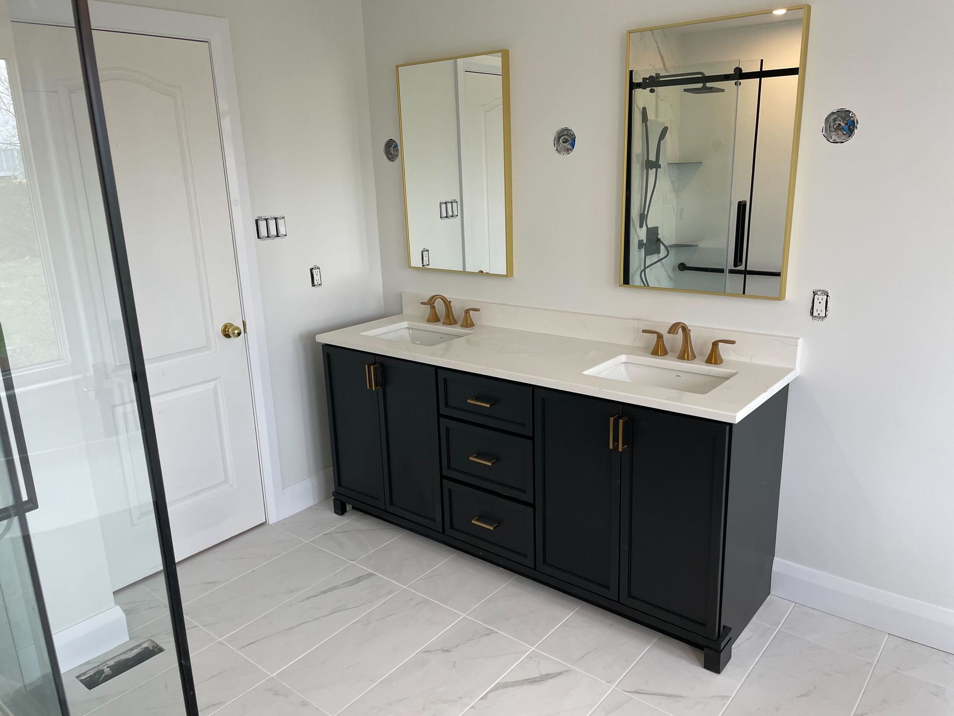 A bathroom with a walk in shower , bathtub , sink and toilet.