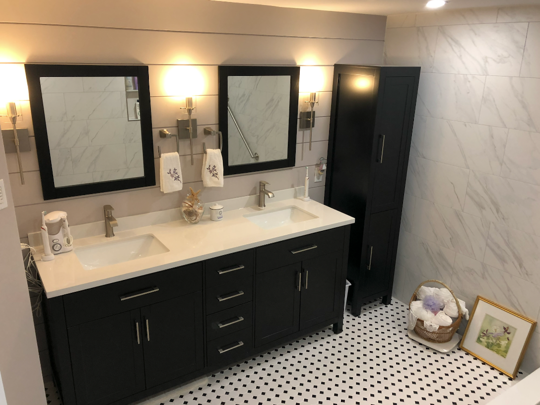 A bathroom with two sinks and two mirrors.