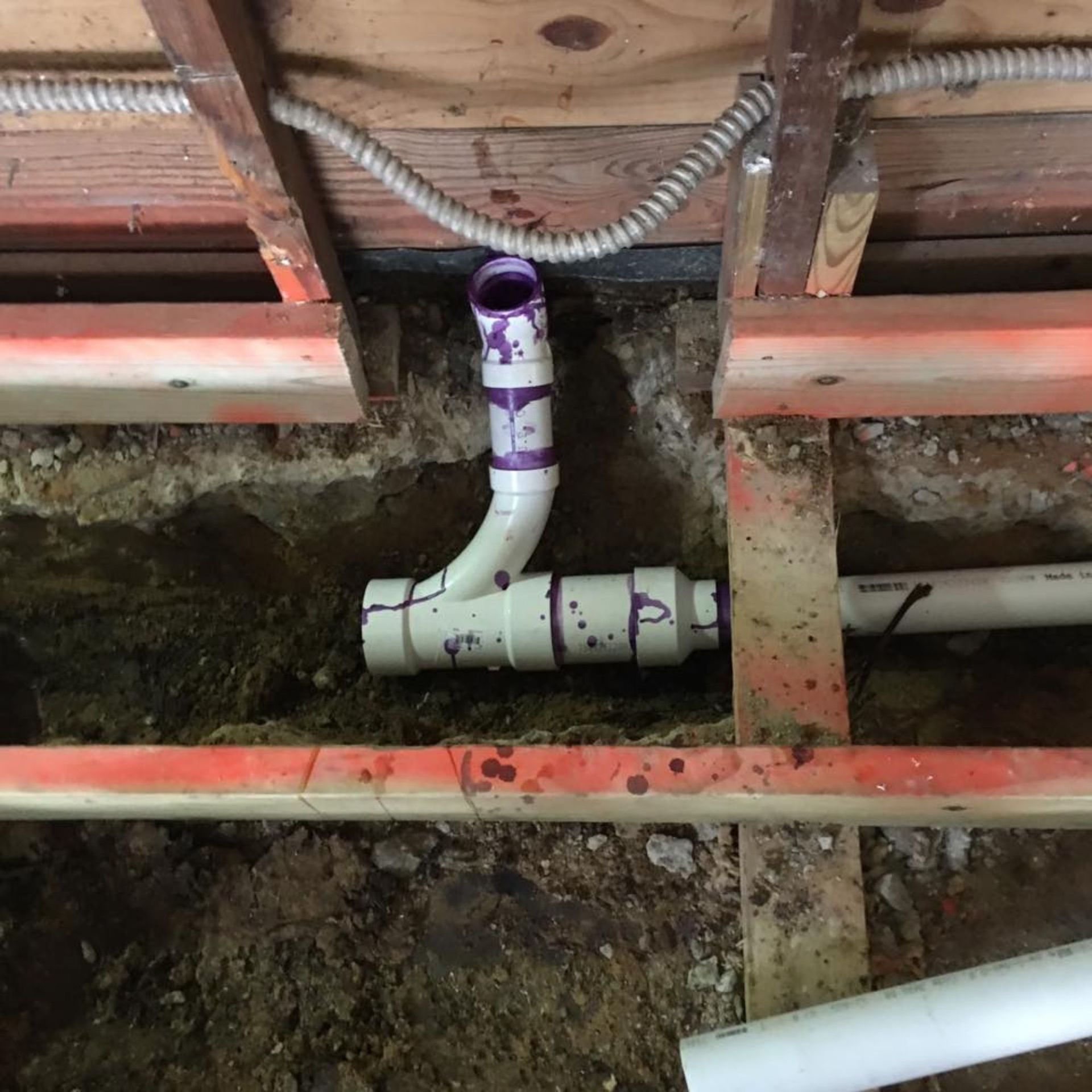 Masters Touch Roofing - A purple pipe is connected to a white pipe