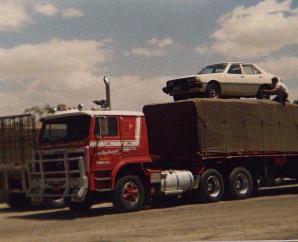 A Truck Loaded a Car on Top with a Man | Swan Hill, Vic | Pickering Transport Group