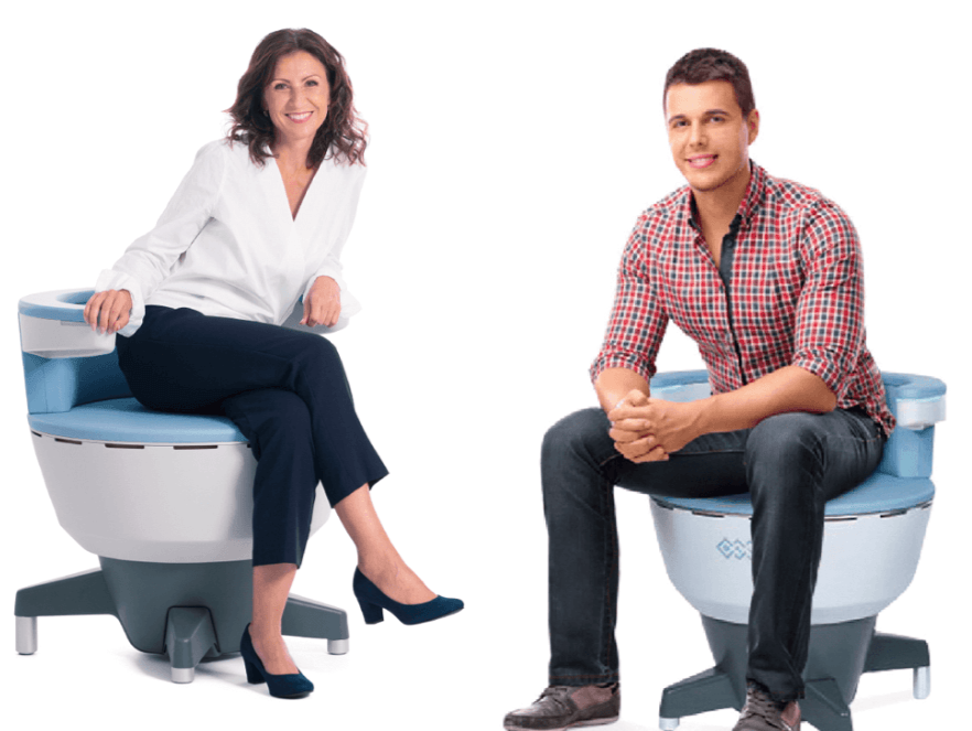 A man and a woman are sitting on a toilet.