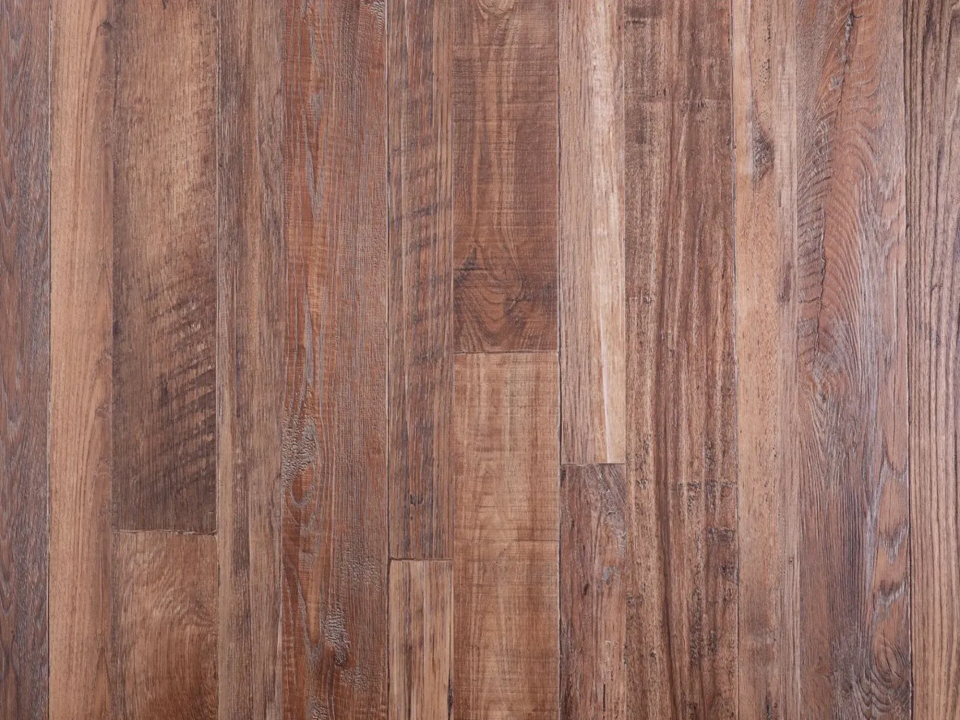 Wooden floorboards in varying shades of brown.