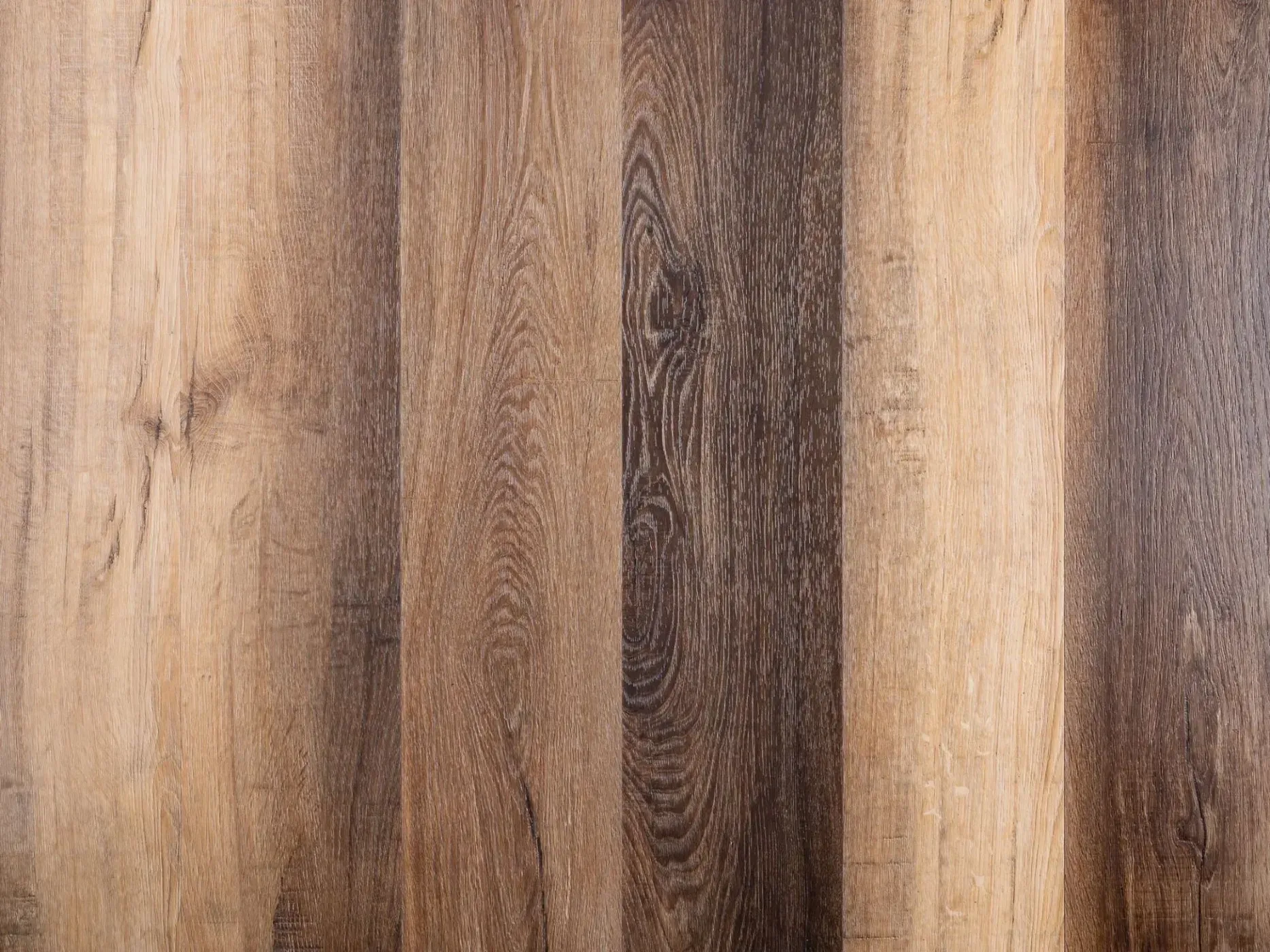 Wooden surface with vertical stripes of light and dark brown.