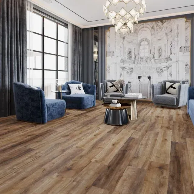 Living room with blue chairs, wooden floor, large window, and decorative chandelier.