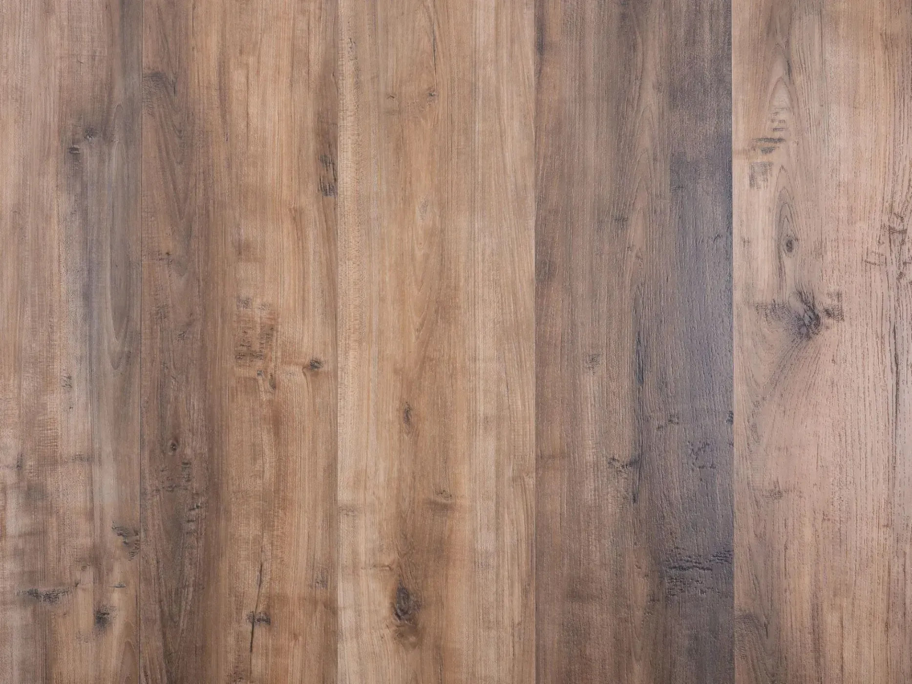 Wooden floor with varying shades of brown and gray planks.