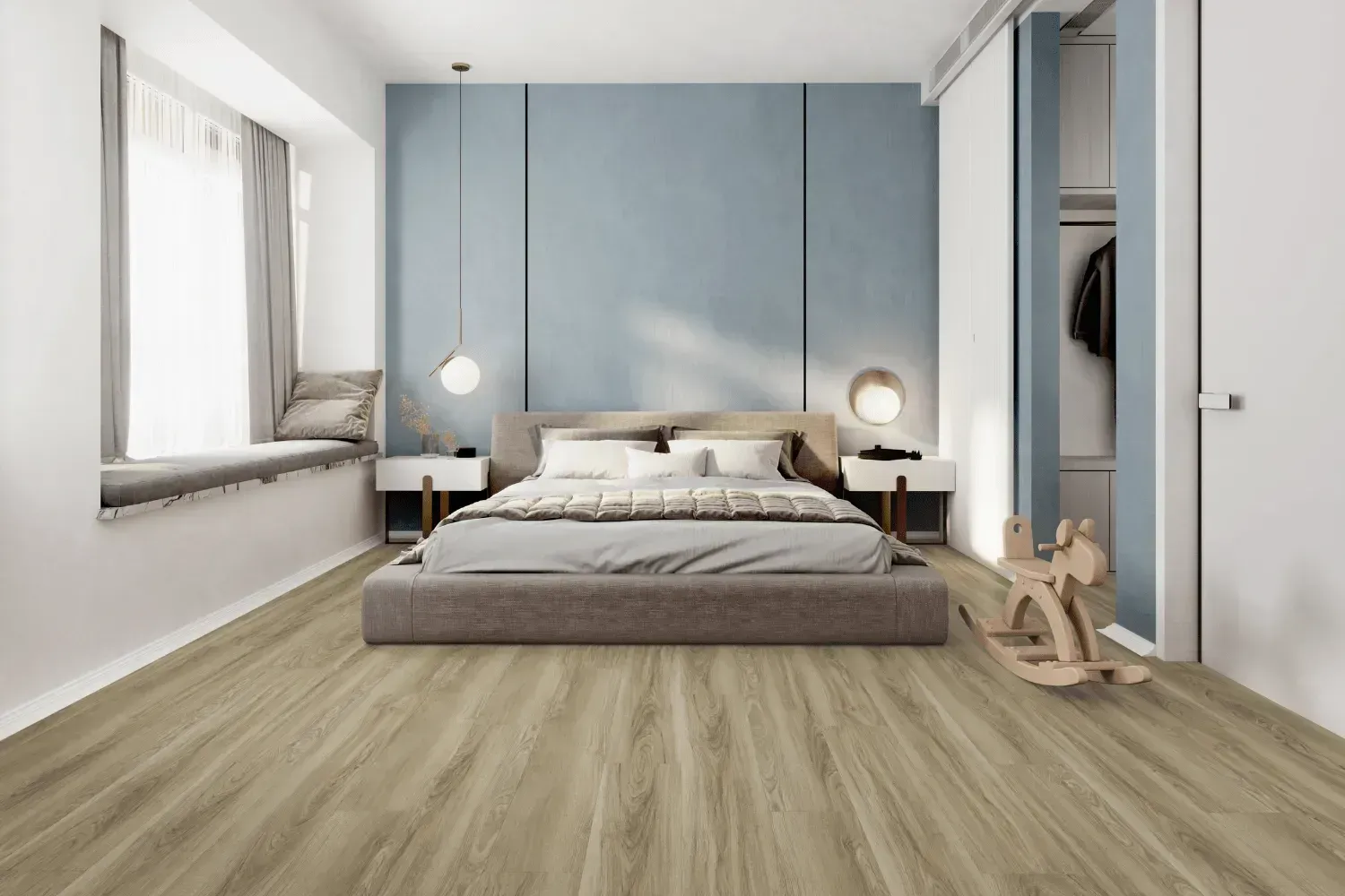 Bedroom with light wood flooring, blue wall, bed, window seat, and white closet.