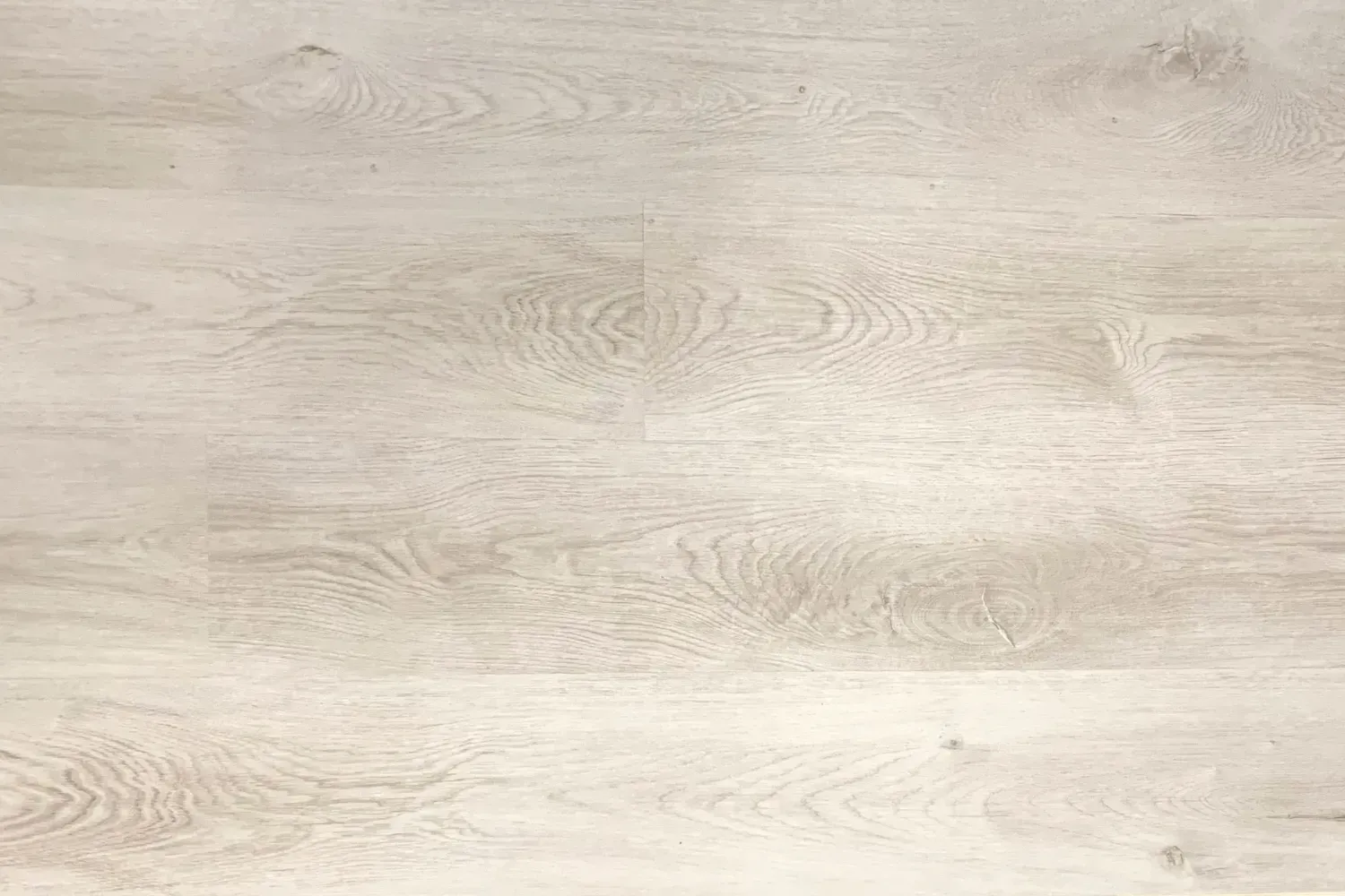 Light-colored wood grain background with horizontal planks.