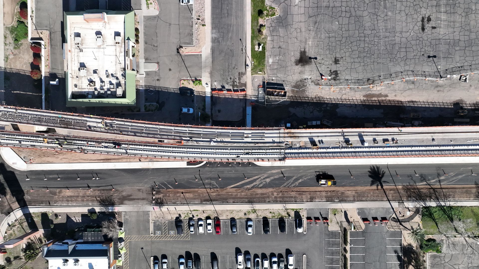 Photo by Phoenix Drone Pros, Robert Biggs, An aerial view of a parking lot and train tracks