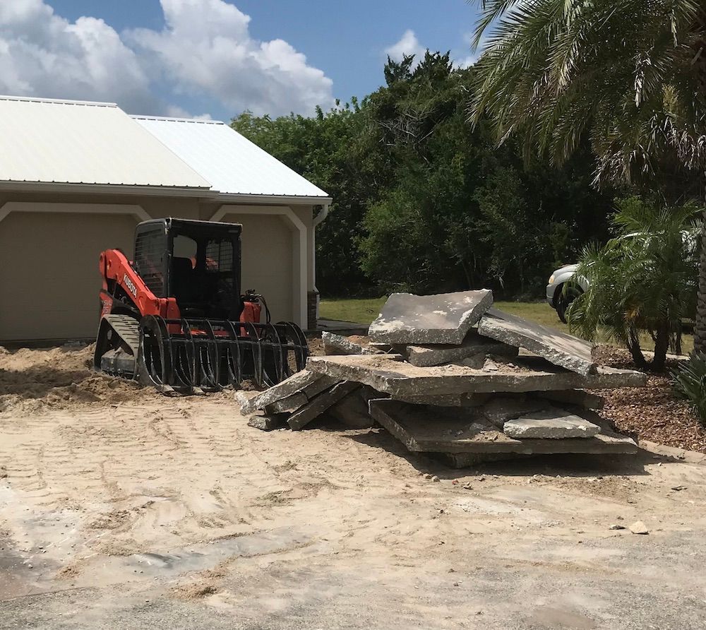A stack of concrete slabs is sitting in front of a house.