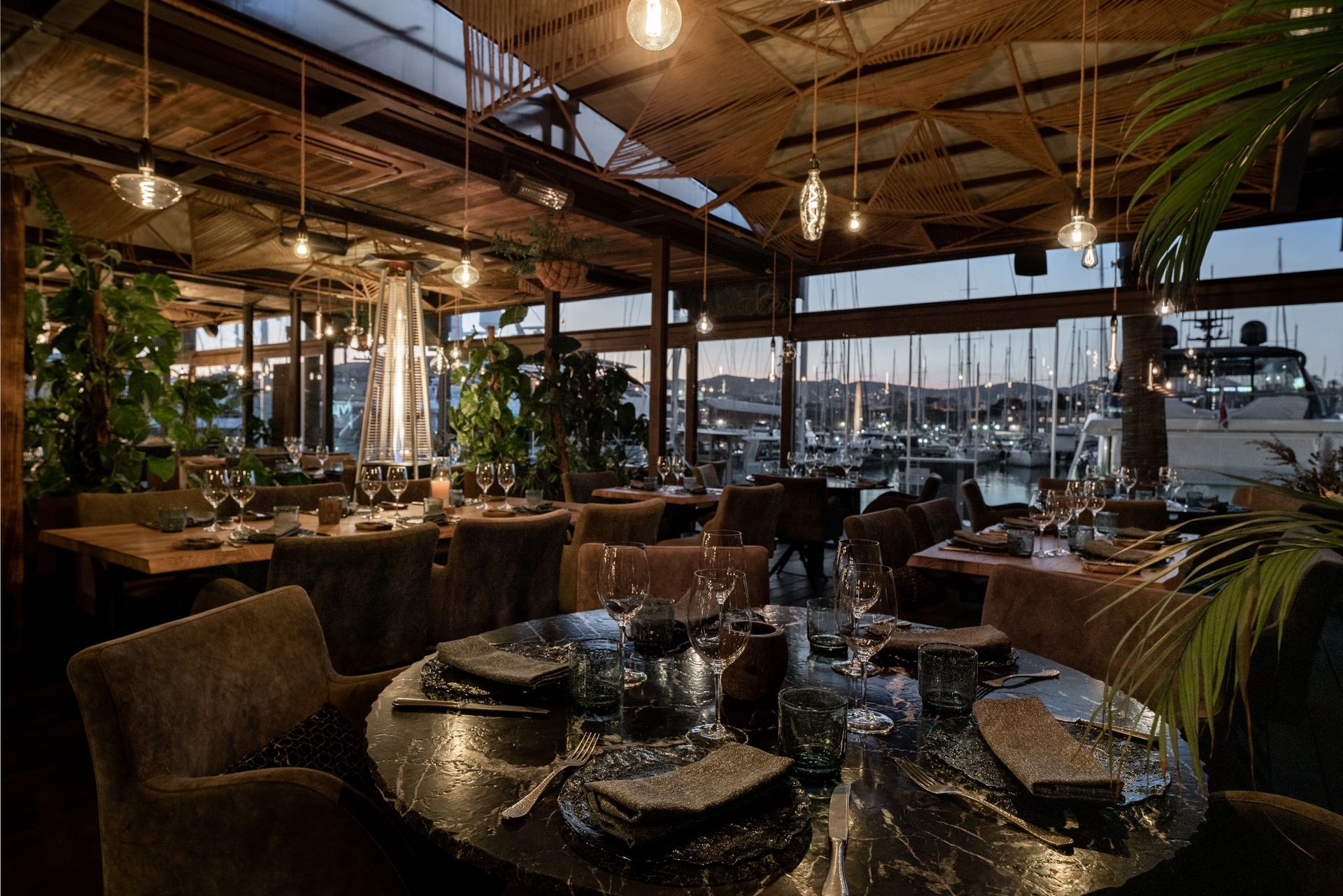 A restaurant with a lot of tables and chairs