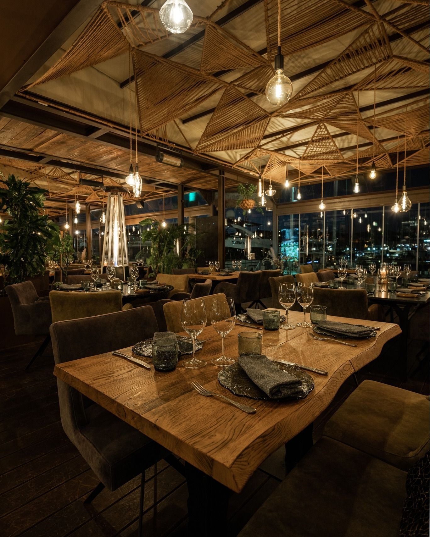 A restaurant with a lot of tables and chairs