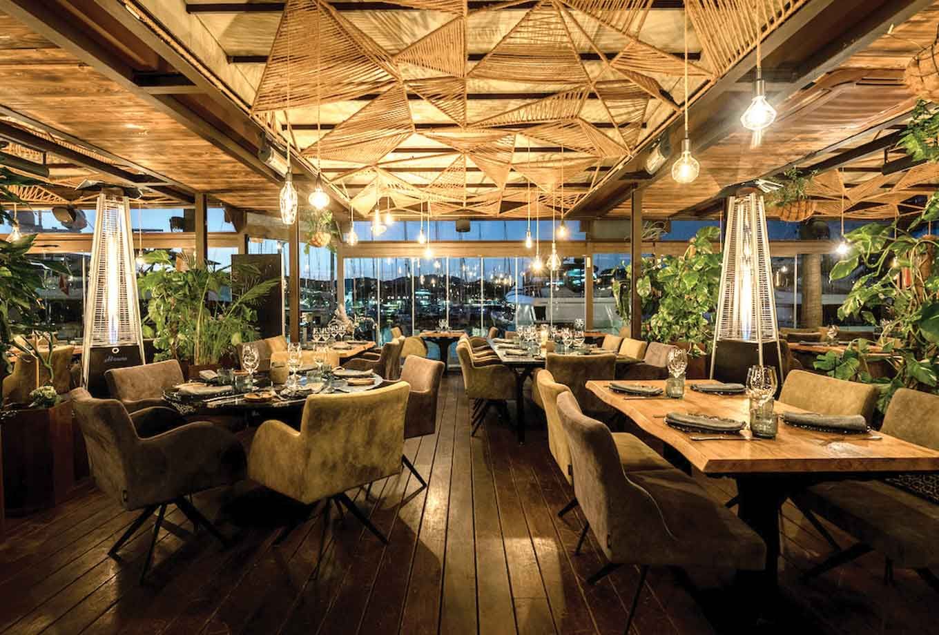 A restaurant with a lot of tables and chairs