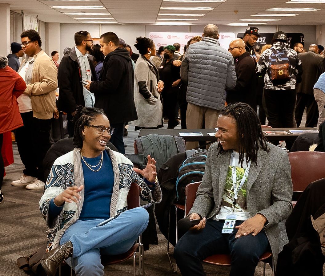 A woman wearing a shirt that says breaking social equity barriers