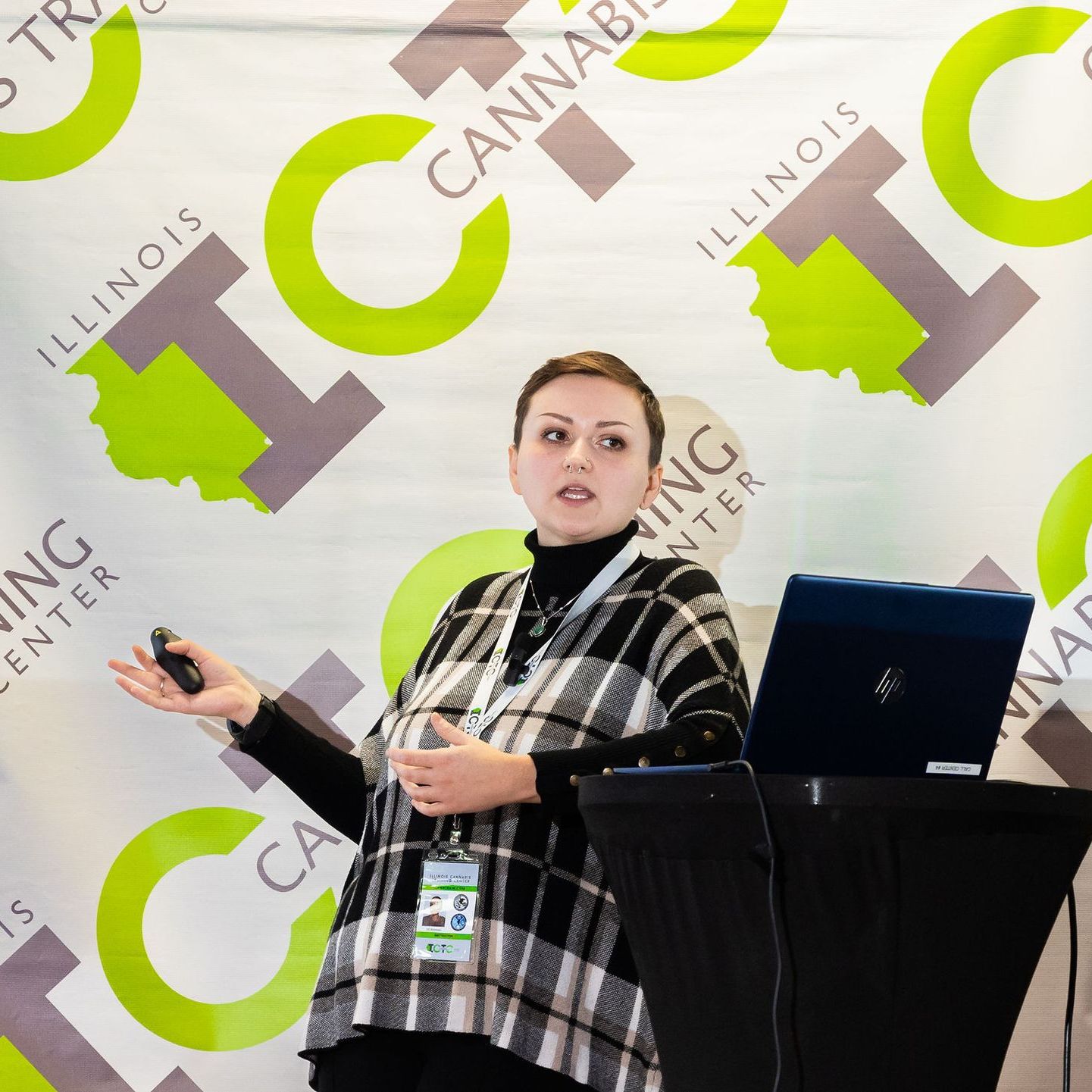 A woman wearing a shirt that says breaking social equity barriers