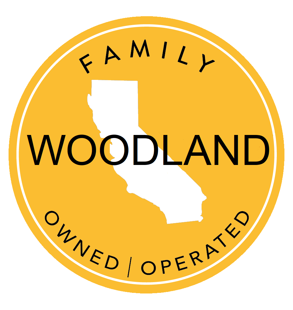 A yellow sticker that says family woodland owned operated