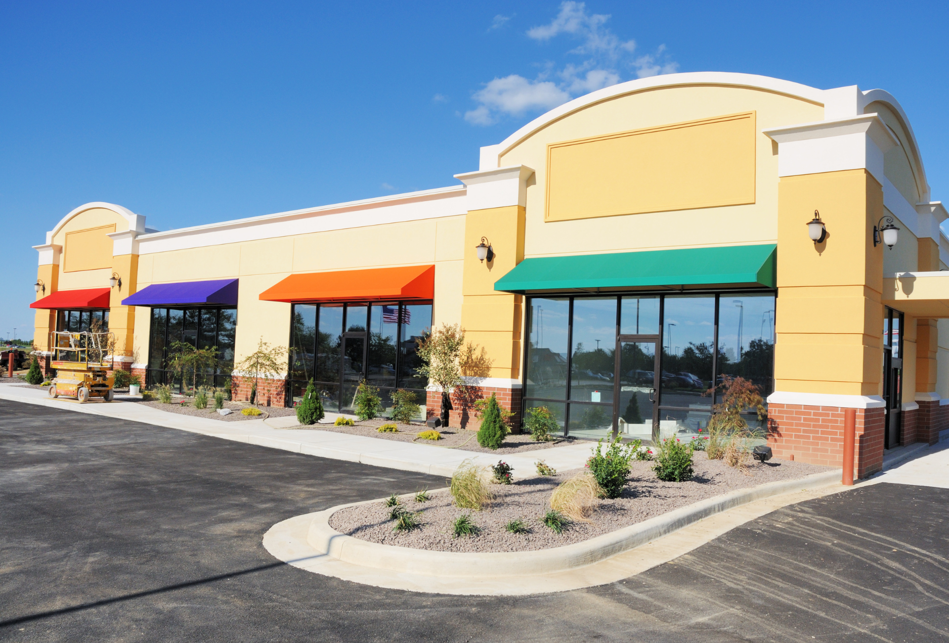 A bathroom with two sinks , a toilet , and a large mirror.