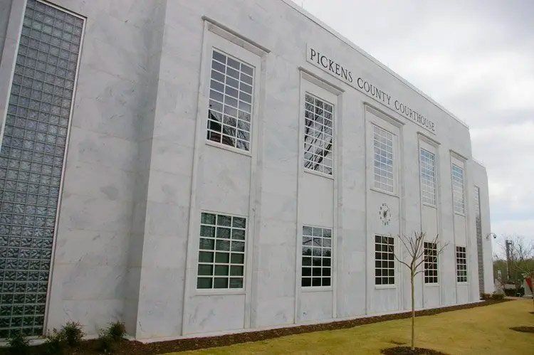 Pickens County Courthouse, a white marble building with large windows and a glass block section.